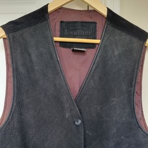 Men's casual leather vest.  Has some scratches but is still in good condition.